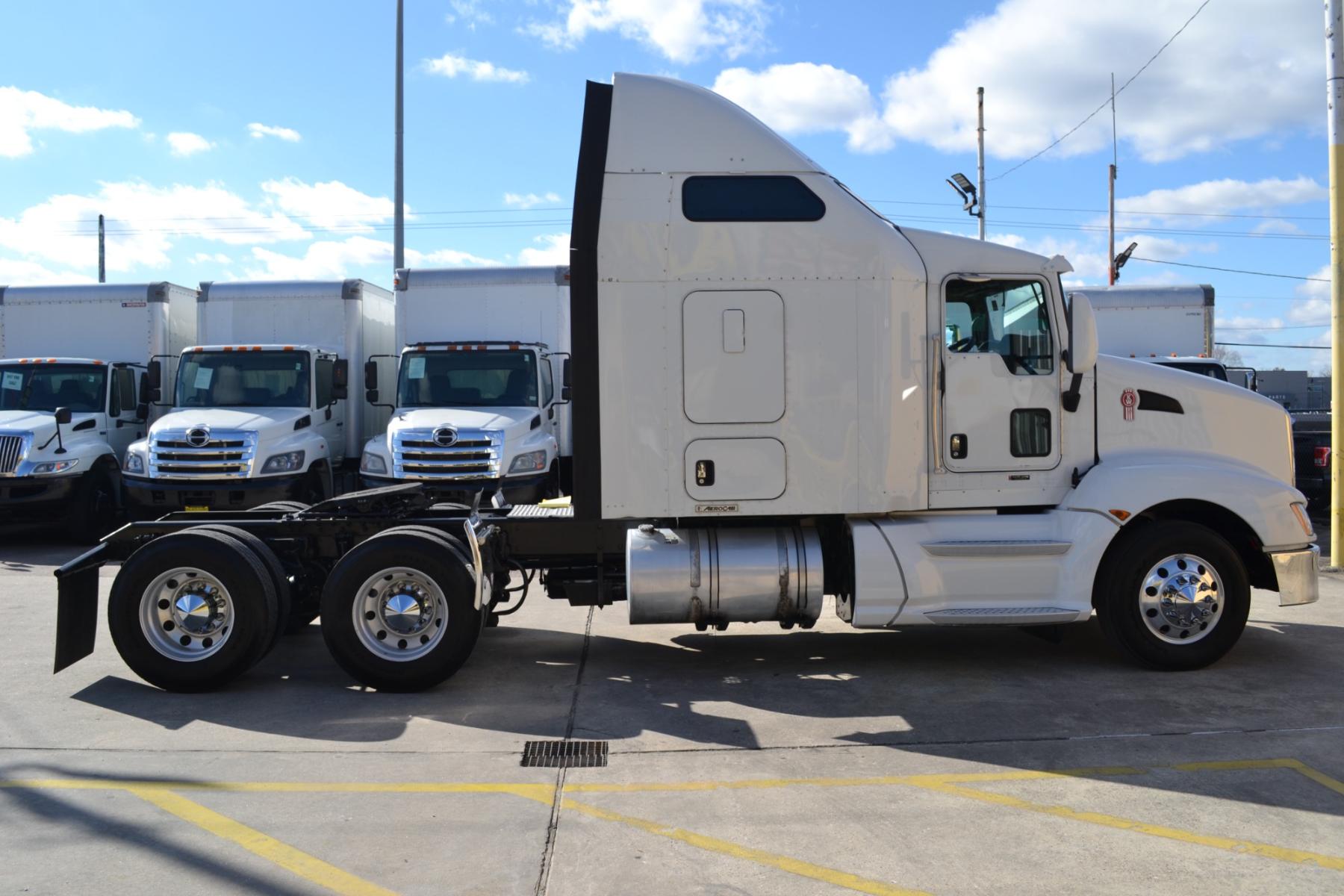 2014 WHITE KENWORTH T660 with an CUMMINS ISX 15L 450HP engine, EATON ULTRASHIFT AUTOMATED transmission, located at 9172 North Fwy, Houston, TX, 77037, (713) 910-6868, 29.887470, -95.411903 - 72" RAISED ROOF SLEEPER, RATIO: 3.42, WB: 223, 51,200LB GVWR, 40,000LB REAR AXLES, SLIDING 5TH WHEEL, ALUMINUM WHEELS, ENGINE BRAKE, DEF FLUID, BOTTOM EXHAUST, 4 BAG AIR RIDE, DUAL 100 GALLON FUEL TANKS, GOOD RUBBER, COLD A/C, CRUISE CONTROL - Photo #3