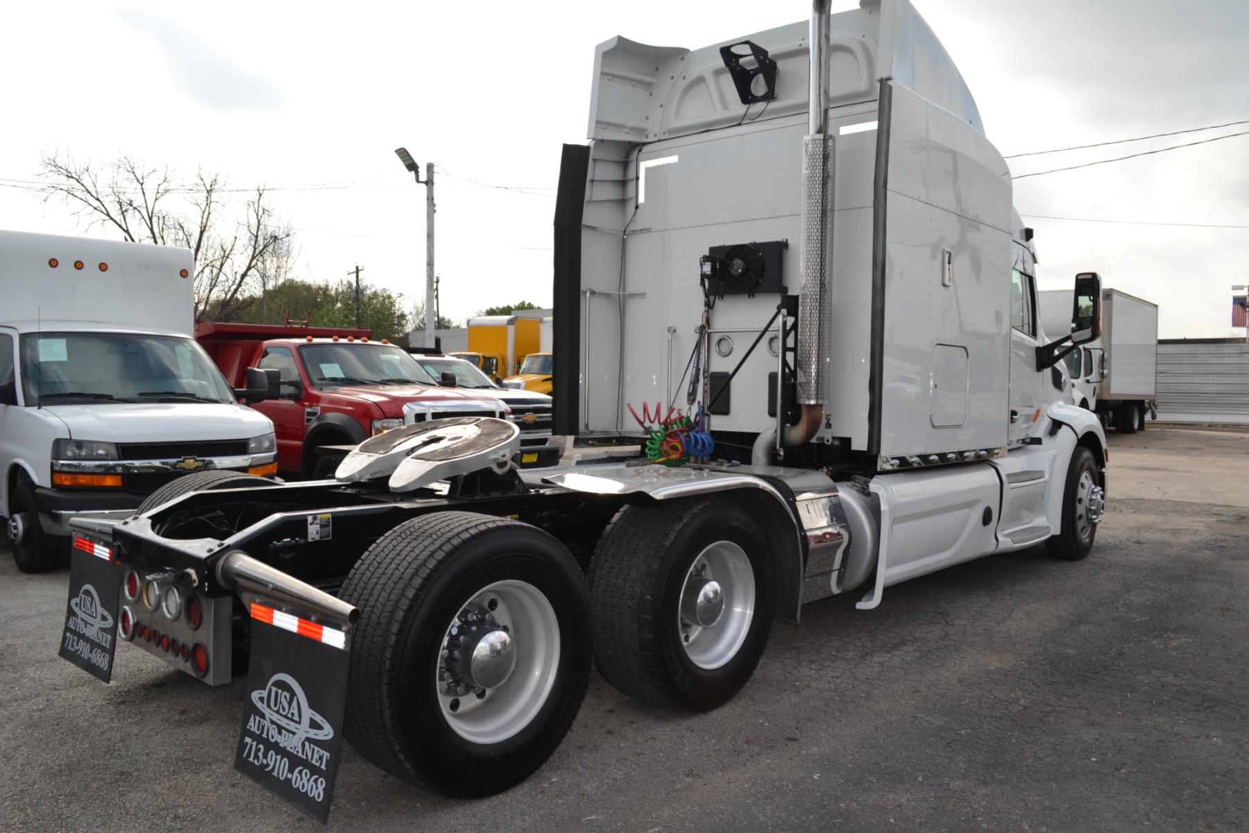 2017 WHITE PETERBILT 579 with an PACCAR MX13 500HP engine, EATON FULLER 10SPD MANUAL transmission, located at 9172 North Fwy, Houston, TX, 77037, (713) 910-6868, 29.887470, -95.411903 - 72" RAISED ROOF SLEEPER, THERMO KING APU, AIR RIDE, CRUISE CONTROL, COLLISION MITIGATION, DIFF LOCK, ENGINE BRAKE, POWER WINDOWS & LOCKS, WB: 240", RATIO: 3.25, DUAL 100 GALLON FUEL TANKS, BUILT-IN NAVIGATION, ALUMINUM WHEELS, - Photo #4