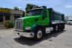 2018 GREEN /GRAY PETERBILT 567 (1XPCD49X8JD) with an CUMMINS X15 14.9L 450 HP engine, EATON FULLER 12 SPD AUTOSHIFT transmission, located at 9172 North Fwy, Houston, TX, 77037, (713) 910-6868, 29.887470, -95.411903 - 16.5 FT DUMP BED, 17 CUBIC YARDS, 14,300 LB FRONT AXLE, 40,000 LB REAR AXLE, 13,000 LB STEERABLE PUSHER AXLE, AIR TRAC SUSPENSION, FULL LOCKERS, ENGINE BRAKE, 70 GALLON FUEL TANK, RATIO; 3.36, ELECTRIC TARP M - Photo#0