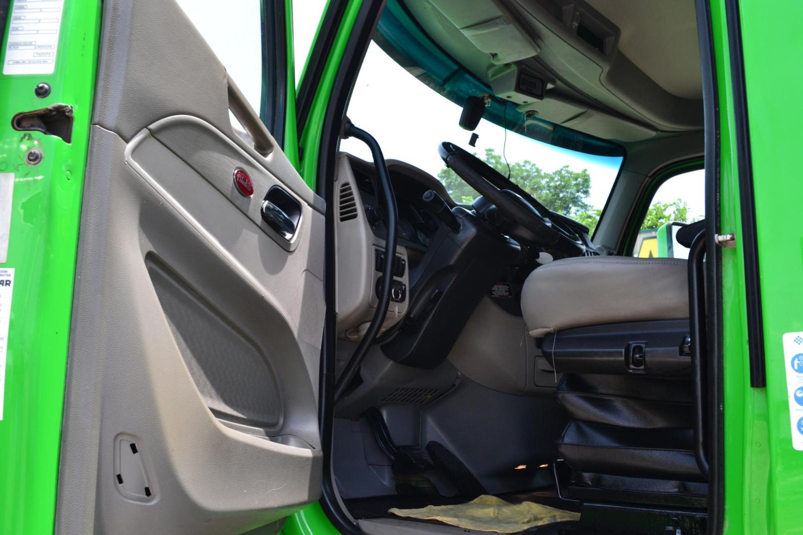 2018 GREEN /GRAY PETERBILT 567 (1XPCD49X8JD) with an CUMMINS X15 14.9L 450 HP engine, EATON FULLER 12 SPD AUTOSHIFT transmission, located at 9172 North Fwy, Houston, TX, 77037, (713) 910-6868, 29.887470, -95.411903 - 16.5 FT DUMP BED, 17 CUBIC YARDS, 14,300 LB FRONT AXLE, 40,000 LB REAR AXLE, 13,000 LB STEERABLE PUSHER AXLE, AIR TRAC SUSPENSION, FULL LOCKERS, ENGINE BRAKE, 70 GALLON FUEL TANK, RATIO; 3.36, ELECTRIC TARP M - Photo#12