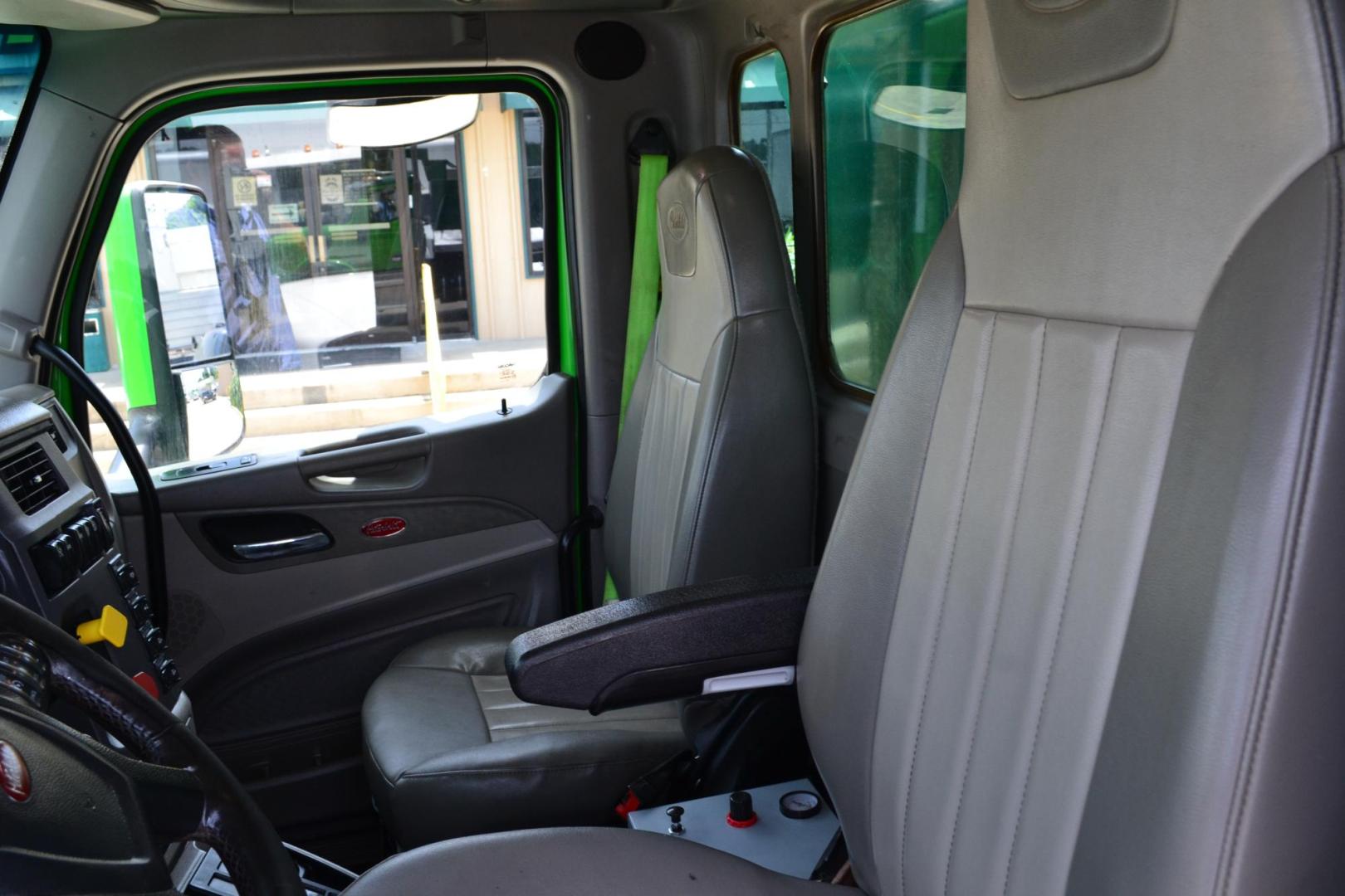2018 GREEN /GRAY PETERBILT 567 (1XPCD49X8JD) with an CUMMINS X15 14.9L 450 HP engine, EATON FULLER 12 SPD AUTOSHIFT transmission, located at 9172 North Fwy, Houston, TX, 77037, (713) 910-6868, 29.887470, -95.411903 - 16.5 FT DUMP BED, 17 CUBIC YARDS, 14,300 LB FRONT AXLE, 40,000 LB REAR AXLE, 13,000 LB STEERABLE PUSHER AXLE, AIR TRAC SUSPENSION, FULL LOCKERS, ENGINE BRAKE, 70 GALLON FUEL TANK, RATIO; 3.36, ELECTRIC TARP M - Photo#13