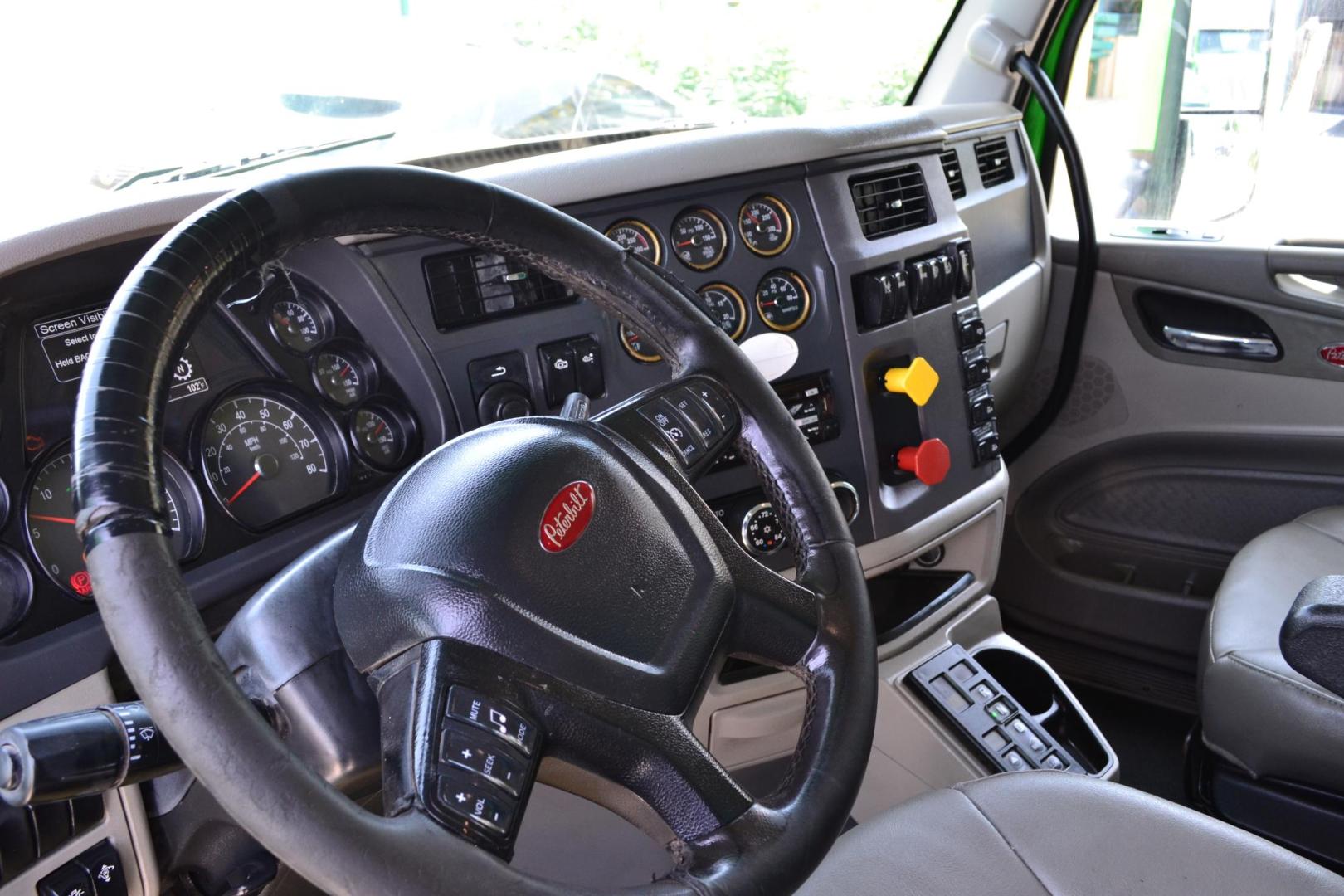 2018 GREEN /GRAY PETERBILT 567 (1XPCD49X8JD) with an CUMMINS X15 14.9L 450 HP engine, EATON FULLER 12 SPD AUTOSHIFT transmission, located at 9172 North Fwy, Houston, TX, 77037, (713) 910-6868, 29.887470, -95.411903 - 16.5 FT DUMP BED, 17 CUBIC YARDS, 14,300 LB FRONT AXLE, 40,000 LB REAR AXLE, 13,000 LB STEERABLE PUSHER AXLE, AIR TRAC SUSPENSION, FULL LOCKERS, ENGINE BRAKE, 70 GALLON FUEL TANK, RATIO; 3.36, ELECTRIC TARP M - Photo#14
