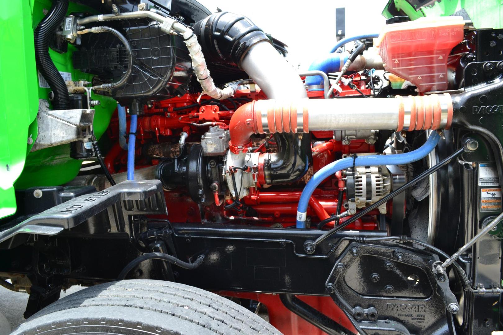 2018 GREEN /GRAY PETERBILT 567 (1XPCD49X8JD) with an CUMMINS X15 14.9L 450 HP engine, EATON FULLER 12 SPD AUTOSHIFT transmission, located at 9172 North Fwy, Houston, TX, 77037, (713) 910-6868, 29.887470, -95.411903 - 16.5 FT DUMP BED, 17 CUBIC YARDS, 14,300 LB FRONT AXLE, 40,000 LB REAR AXLE, 13,000 LB STEERABLE PUSHER AXLE, AIR TRAC SUSPENSION, FULL LOCKERS, ENGINE BRAKE, 70 GALLON FUEL TANK, RATIO; 3.36, ELECTRIC TARP M - Photo#20