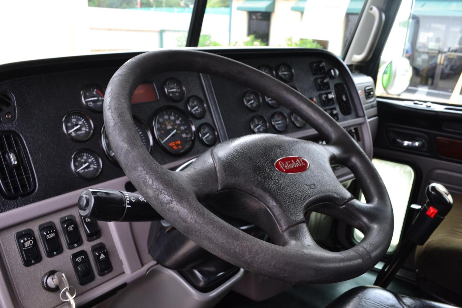 2012 GREEN /BLACK PETERBILT 367 (1XPTD49X3CD) with an CUMMINS X15 14.9L 485 HP engine, 13 SPD MANUAL transmission, located at 9172 North Fwy, Houston, TX, 77037, (713) 910-6868, 29.887470, -95.411903 - 16 FT DUMP BODY, 17 CUBIC YARDS, PETERBILT AIR TRAC SUSPENSION, FULL LOCKERS, ENGINE BRAKE, 12K FRONT , 40K REAR, 13K LIFT AXLE , POWER WINDOWS, LOCKS AND MIRRORS - Photo#16