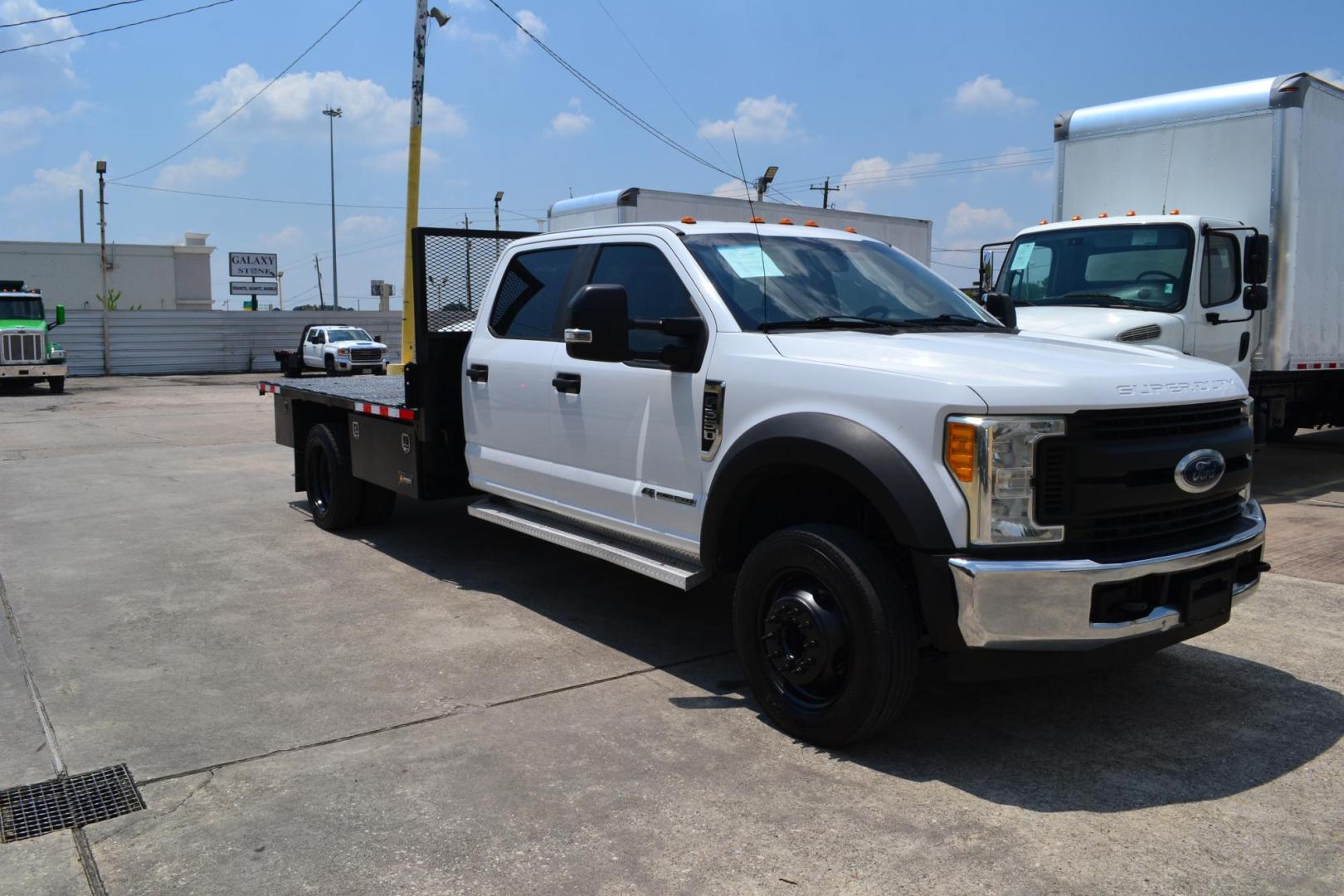 2017 WHITE /BLACK FORD F550 (1FD0W5GT9HE) with an POWERSTROKE 6.7L DIESEL engine, 6SPD AUTOMATIC transmission, located at 9172 North Fwy, Houston, TX, 77037, (713) 910-6868, 29.887470, -95.411903 - 19,500 LB GVWR, 12 FT FLATBED X 96" WIDE, PINTLE HOOK HITCH, 3 X TOOL BOXES, RATIO: 4.88 LIMITED SLIP, WHEELBASE: 203", CREW CAB, POWER WINDOWS , LOCKS & MIRRORS - Photo#2
