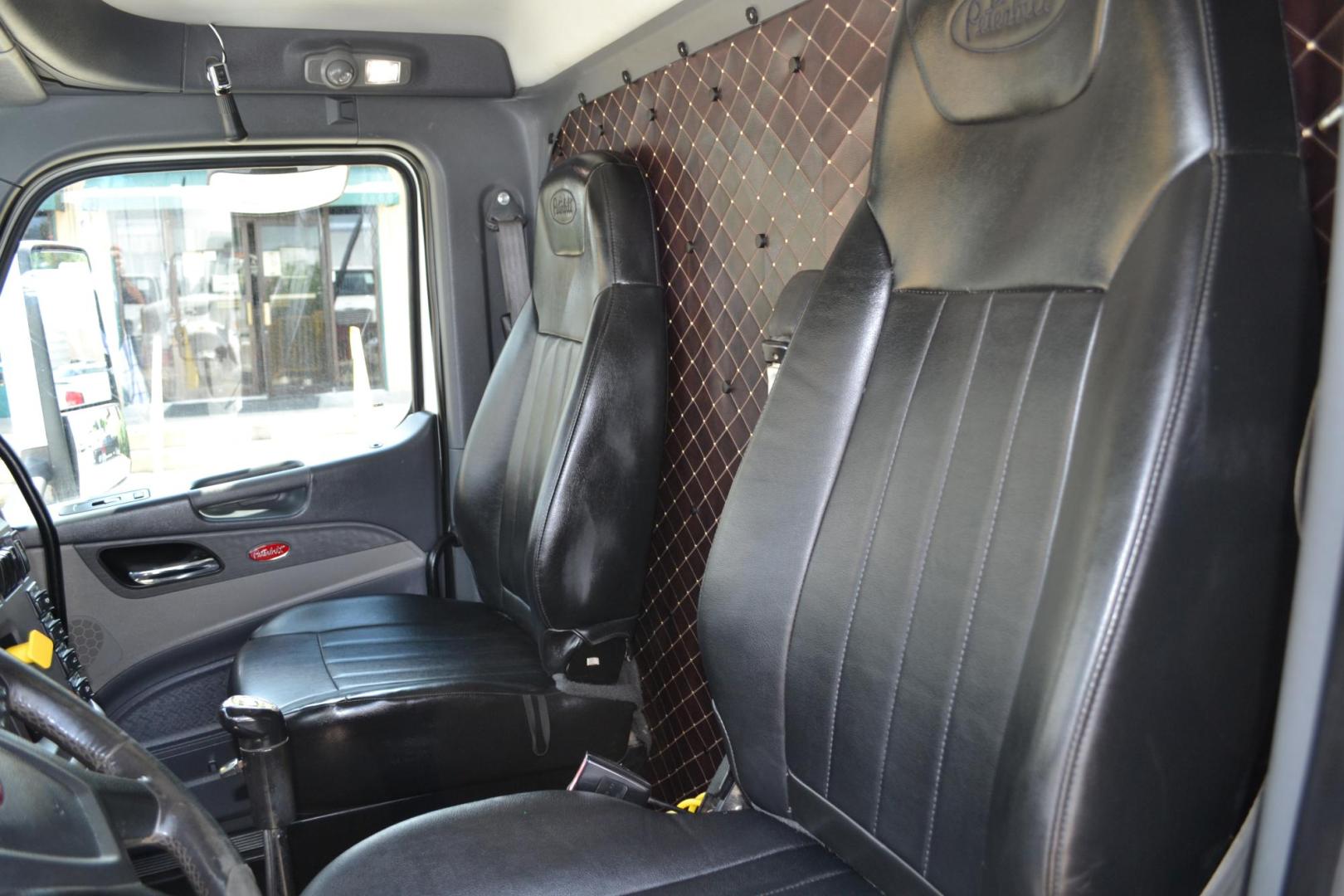 2015 WHITE /BLACK PETERBILT 567 (1XPCD49X3FD) with an CUMMINS X15 14.9L 450 HP engine, 10 SPD MANUAL transmission, located at 9172 North Fwy, Houston, TX, 77037, (713) 910-6868, 29.887470, -95.411903 - FRONT AXLE: 14,320 LB / REAR AXLE: 40,000 LB / STEERABLE LIFT AXLE: 13,000 LB, 17 FT DUMP BED, 17 CUBIC YARDS, AIR TRAC SUSPENSION, DIFF LOCK, ENGINE BRAKE, WHEELBASE: 225", RATIO: 3.70, ELECTRIC TARP, POWER WINDOWS & LOCKS , DUAL STACKS - Photo#12