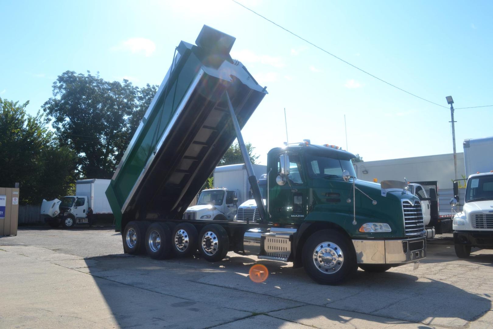 2017 GREEN /BLACK MACK CXU613 (1M1AW07Y0HM) with an MACK MP8 12.8L 505HP engine, 18 SPD MANUAL transmission, located at 9172 North Fwy, Houston, TX, 77037, (713) 910-6868, 29.887470, -95.411903 - 19 FT DUMP BODY= 22 CUBIC YARDS,FRONT AXLE: 14,600 LB , 2 X LIFT AXLES : 13,000 LB, REAR AXLE: 46,000 LB, WHEELBASE: 252", RATIO: 3.73, DOUBLE CHASSIS, FULL LOCKERS, 315 FRONT TIRES, AIR RIDE SUSPENSION, ELECTRIC TARP, 75 GALLON FUEL CAPACITY, AIR TAILGATE, ENGINE BRAKE, POWER WINDOWS & LOCKS & MIRR - Photo#7